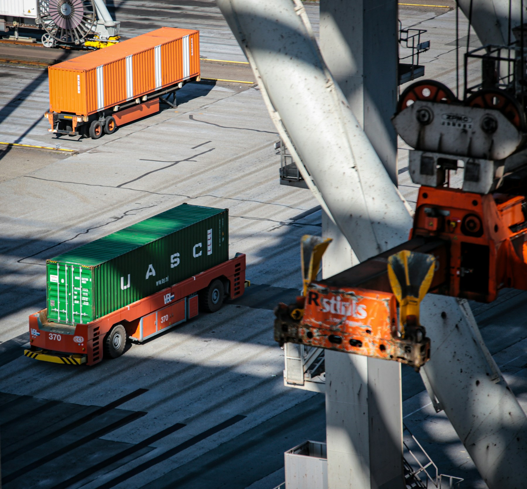Cargo vehicle operating beside a Rotterdam loading facility